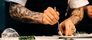 person holding silver spoon